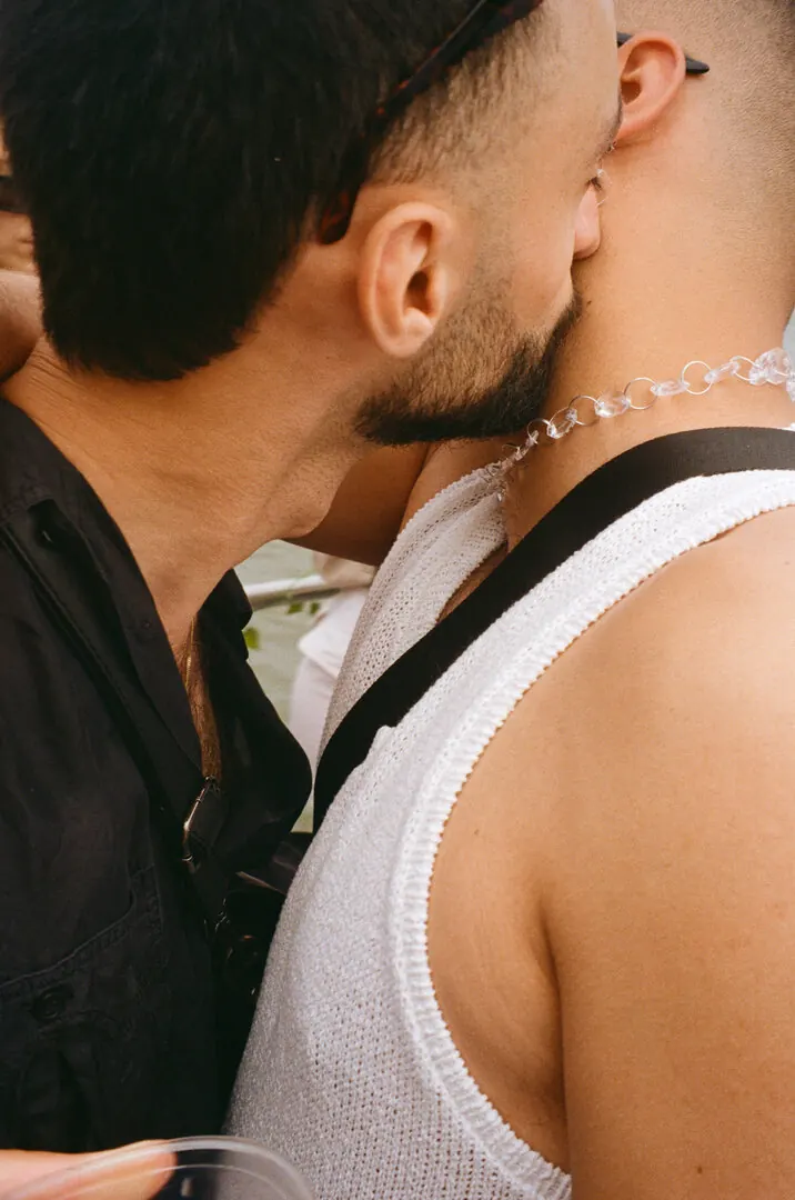 Two men embracing at a party
