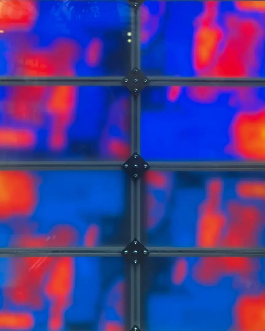 Close up of the panels behind a grid of black joints
