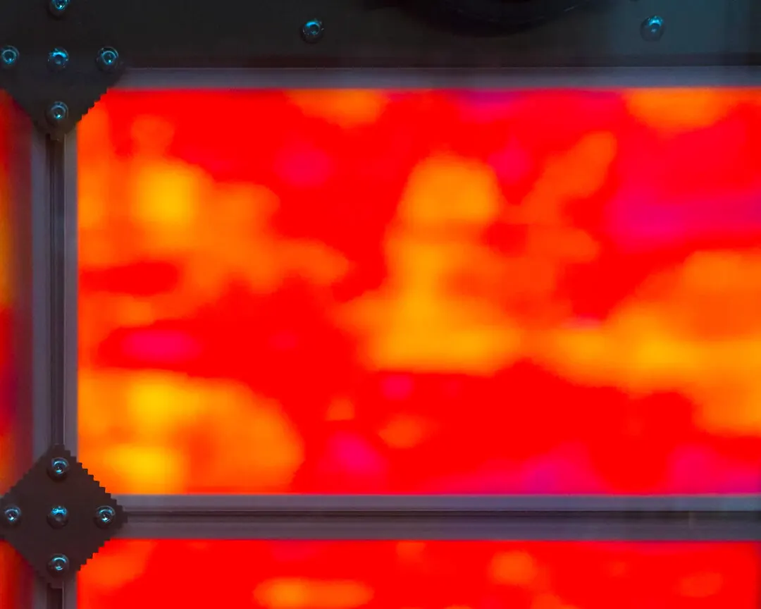 A single panel in saturated red with a bolted corner joint